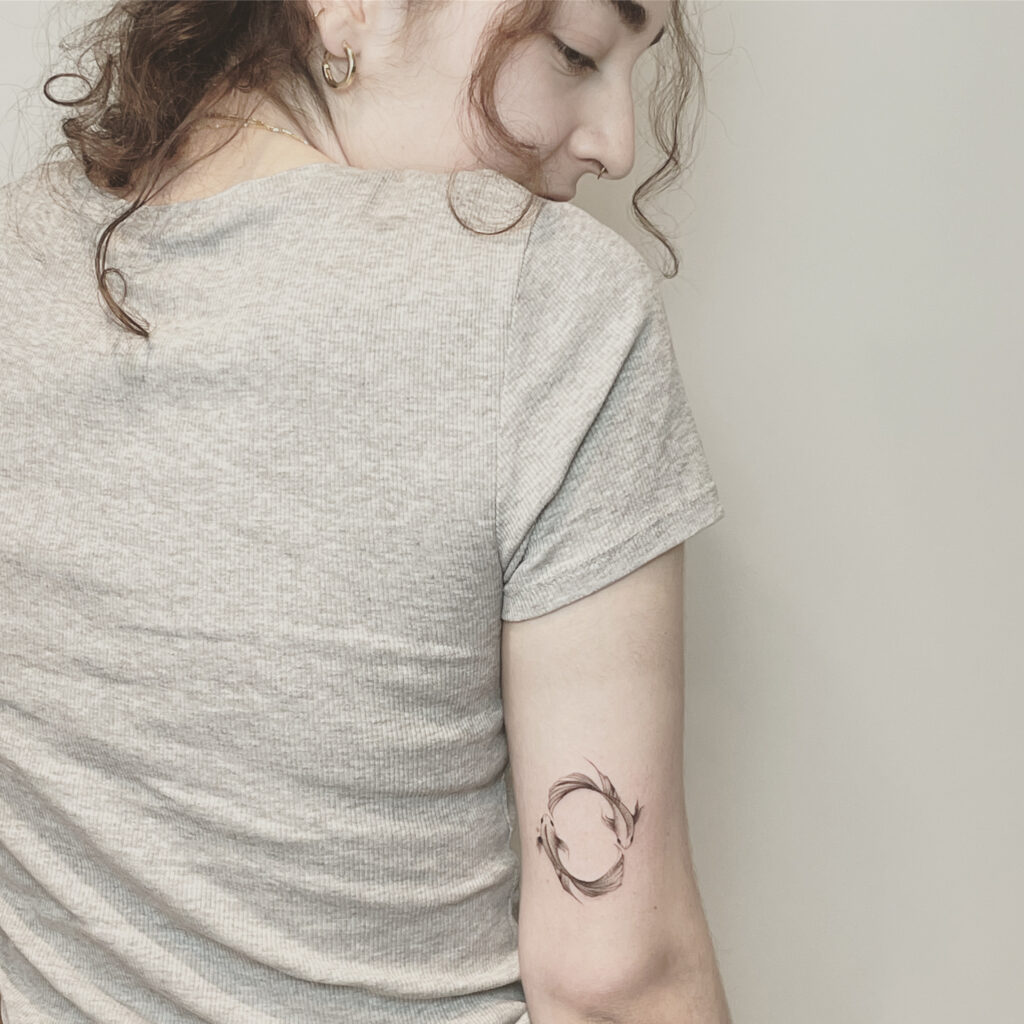 finelines tattoo expert Zürich altststetten minimalistic mini tattoo fish zodiac sign