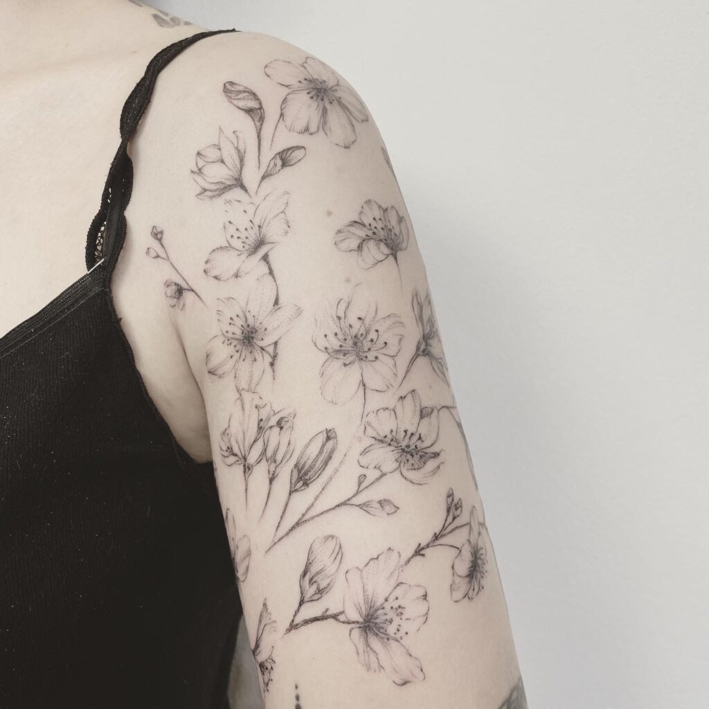 finelines tattoo expert Zürich Altstetten minimalistic linework freehand flower cherry blossom