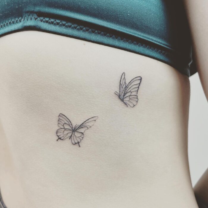 schmetterling tattoo finelines zürich filigran weiblich